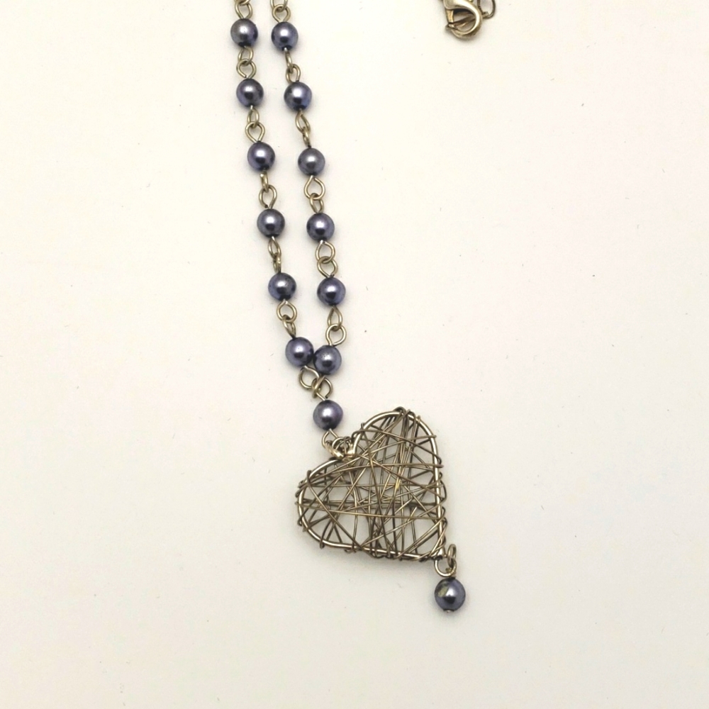 Wire-wrapped heart necklace with purple beads